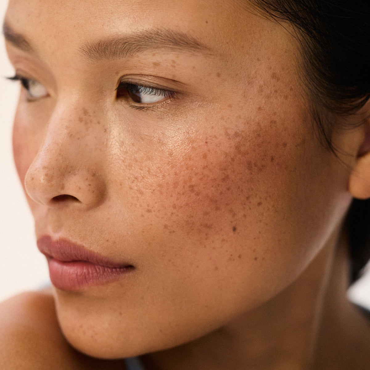 Medium skin tone model wearing Impressionist Multistick in Intuition